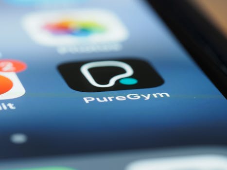 Detailed close-up photo of the PureGym app icon on a smartphone screen, highlighting modern technology.