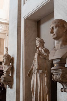 Explore ancient Roman sculptures in the Vatican Museum with marble busts and statues.